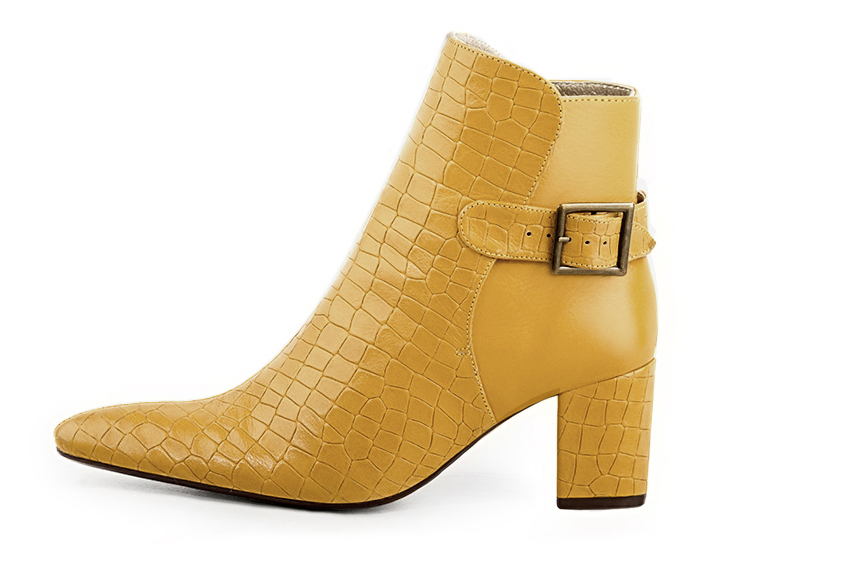 Mustard yellow women's ankle boots with buckles at the back. Tapered toe. Medium block heels. Profile view - Florence KOOIJMAN